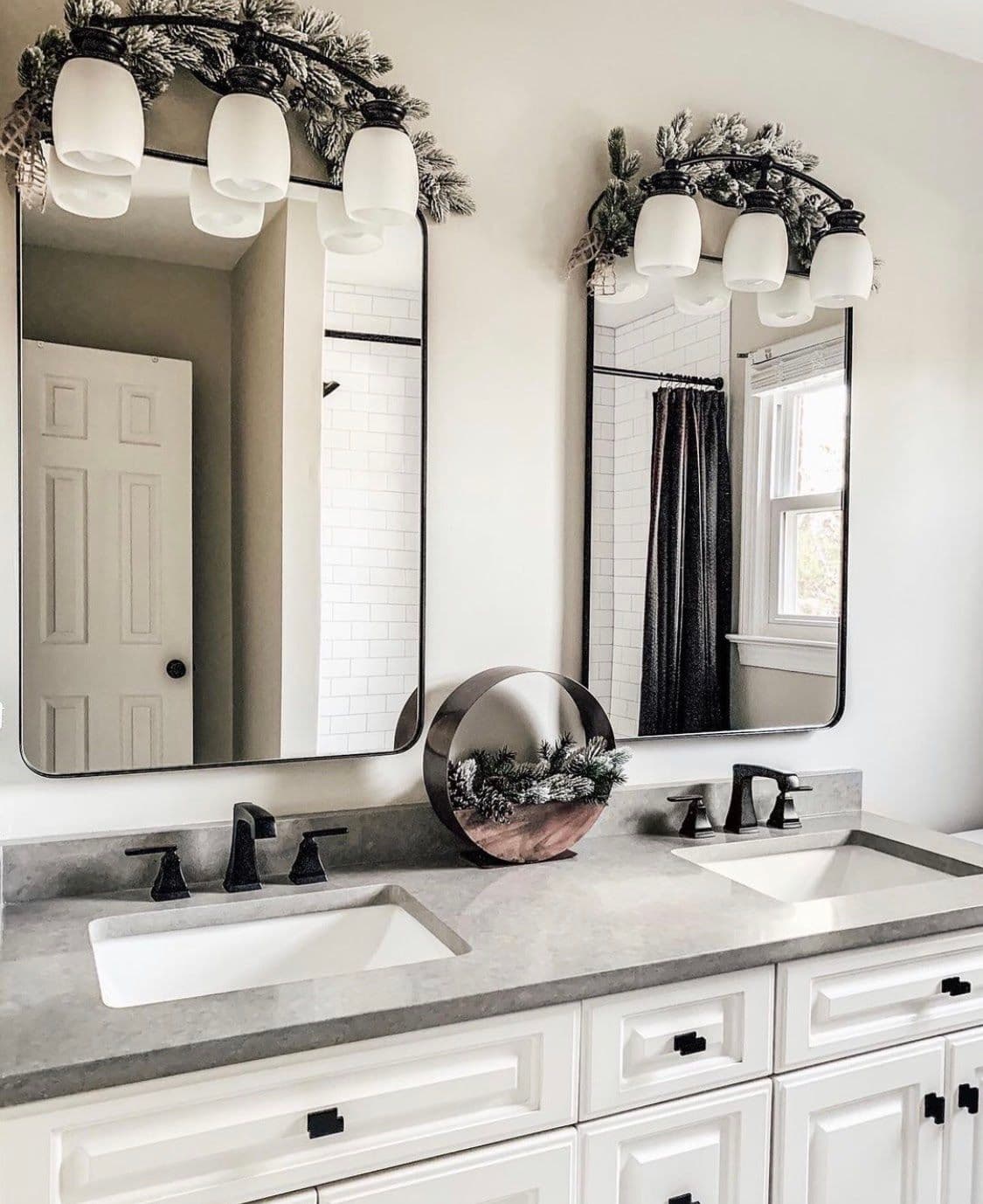 Modern bathroom featuring custom beveled glass mirrors above dual sinks