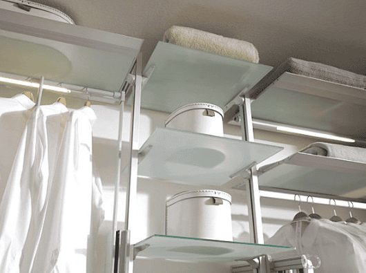 Frosted glass shelves with buckets in closet