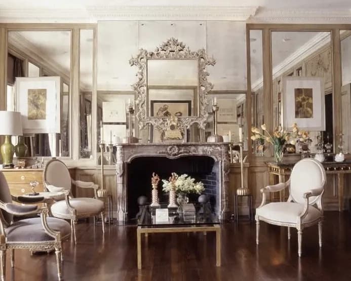 Elegant living room featuring custom mirrors and a glass-topped coffee table