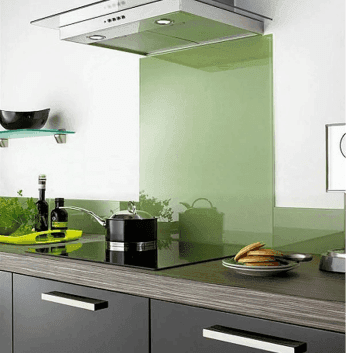 Kitchen with custom glass backsplash, showcasing tempered glass and a modern aesthetic, ideal for enhancing shower doors, table tops, and mirrors with beveled glass edges.