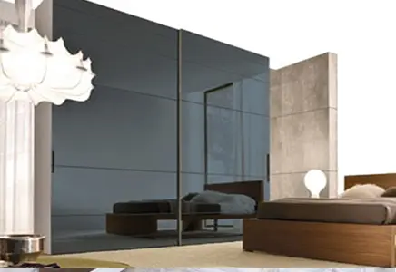 Custom glass wall mirrors reflecting modern design with sleek beveled edges, ideal for enhancing interiors alongside shower doors and table tops.