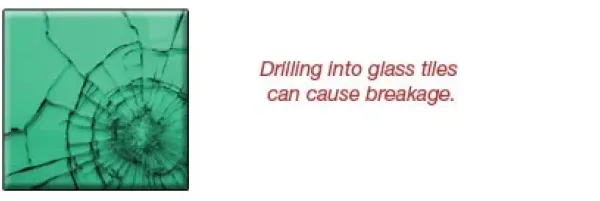 Green glass tile with a crack, accompanied by text warning that drilling into glass tiles can cause breakage; relevant to custom glass and tempered glass products.