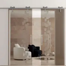 Custom glass shower doors featuring a modern design with tempered glass and a unique beveled edge, enhancing bathroom aesthetics.