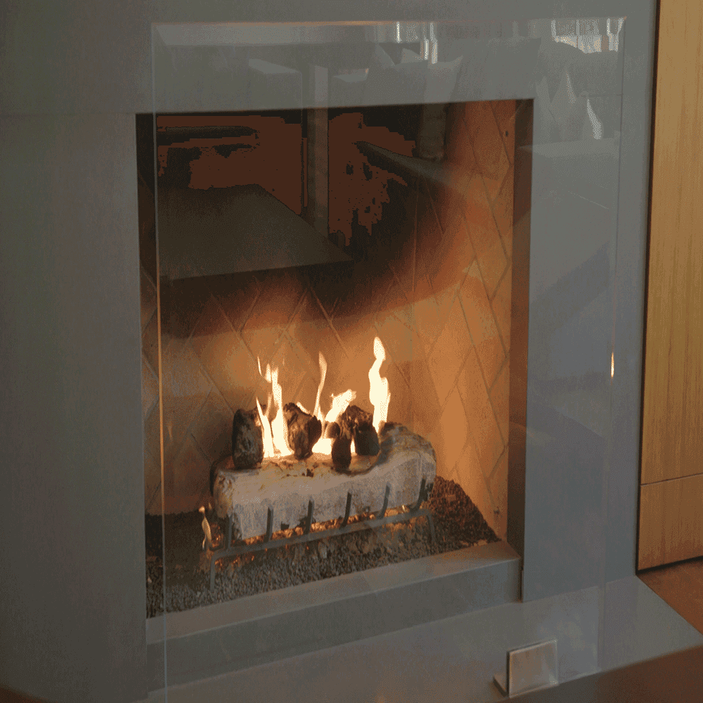 Tempered glass fireplace surround showcasing custom glass design, enhancing modern decor with elegance.