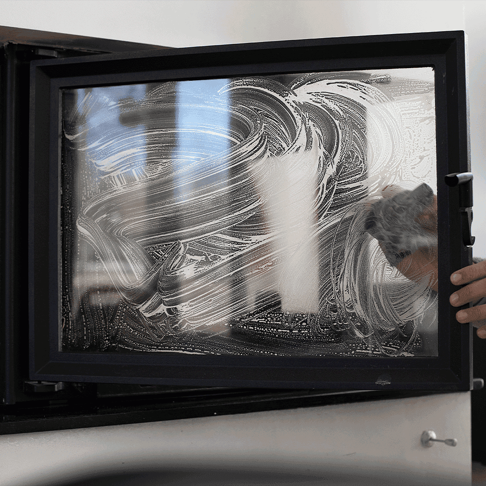 cleaning fireplace glass door