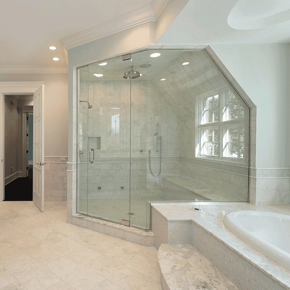 Custom shower doors with tempered glass, featuring a beveled glass edge, in a luxurious bathroom with marble finishes and a soaking tub.