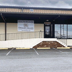 Showroom exterior of Dulles Glass featuring custom glass products including shower doors, table tops, mirrors, tempered glass, and beveled glass edges.