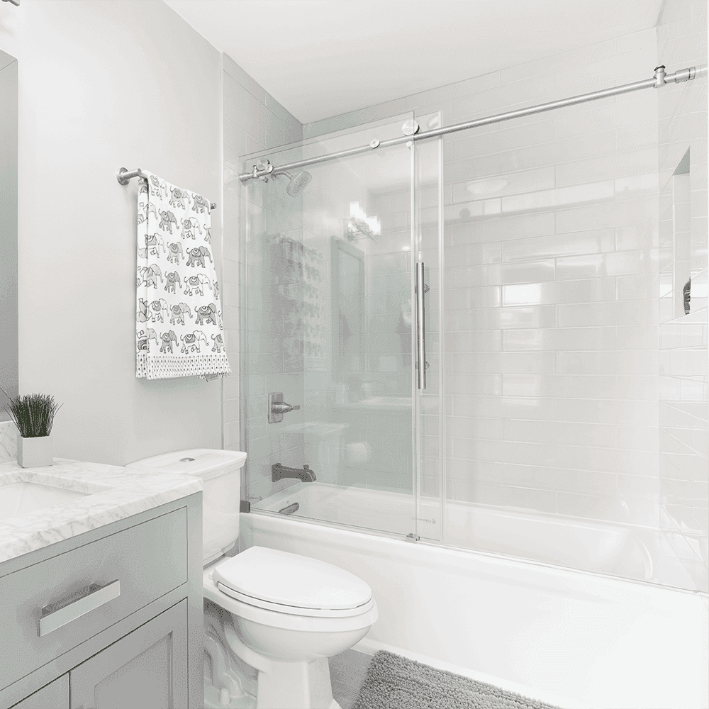 Modern bathroom featuring sleek tempered glass shower doors