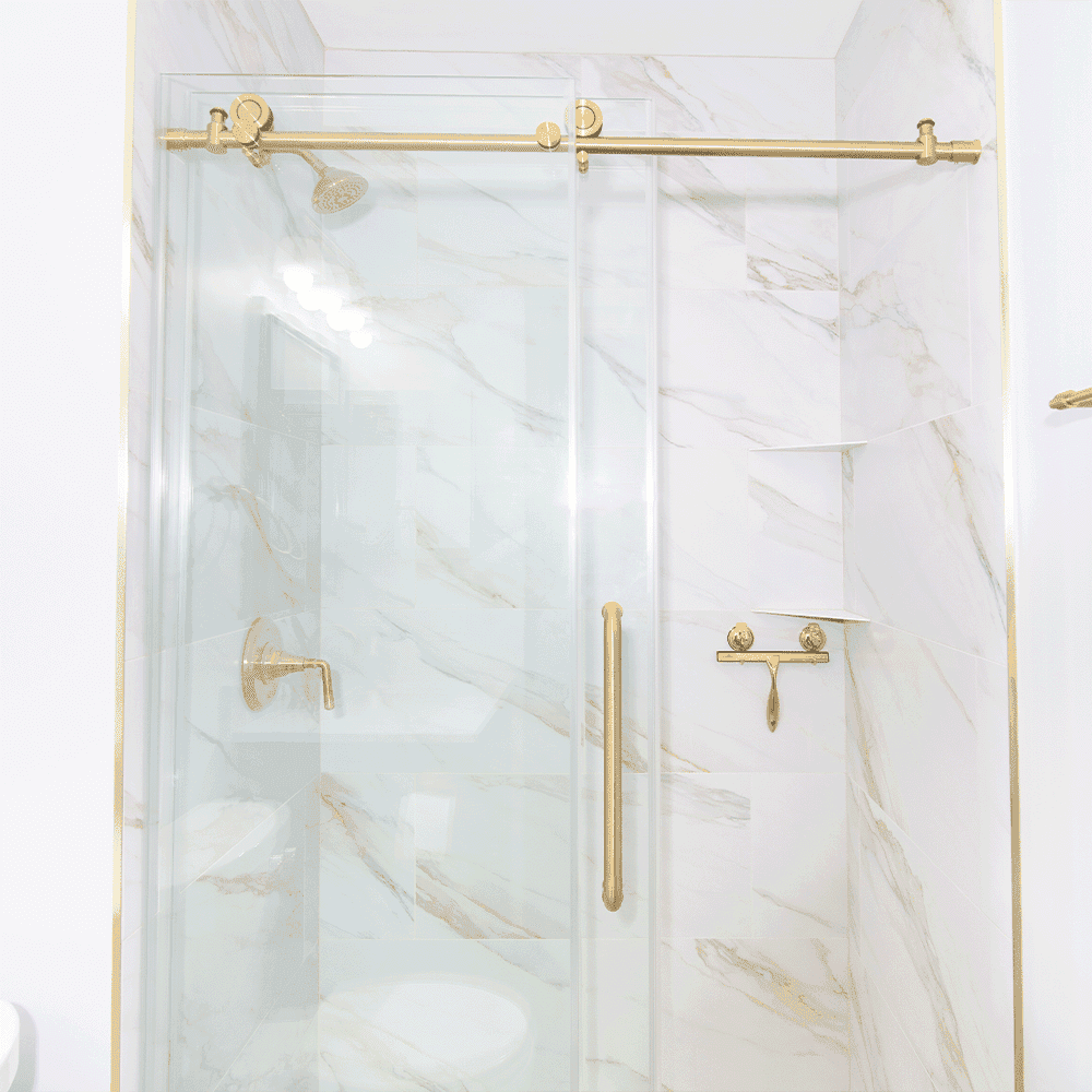 Shower doors featuring custom tempered glass with elegant gold hardware