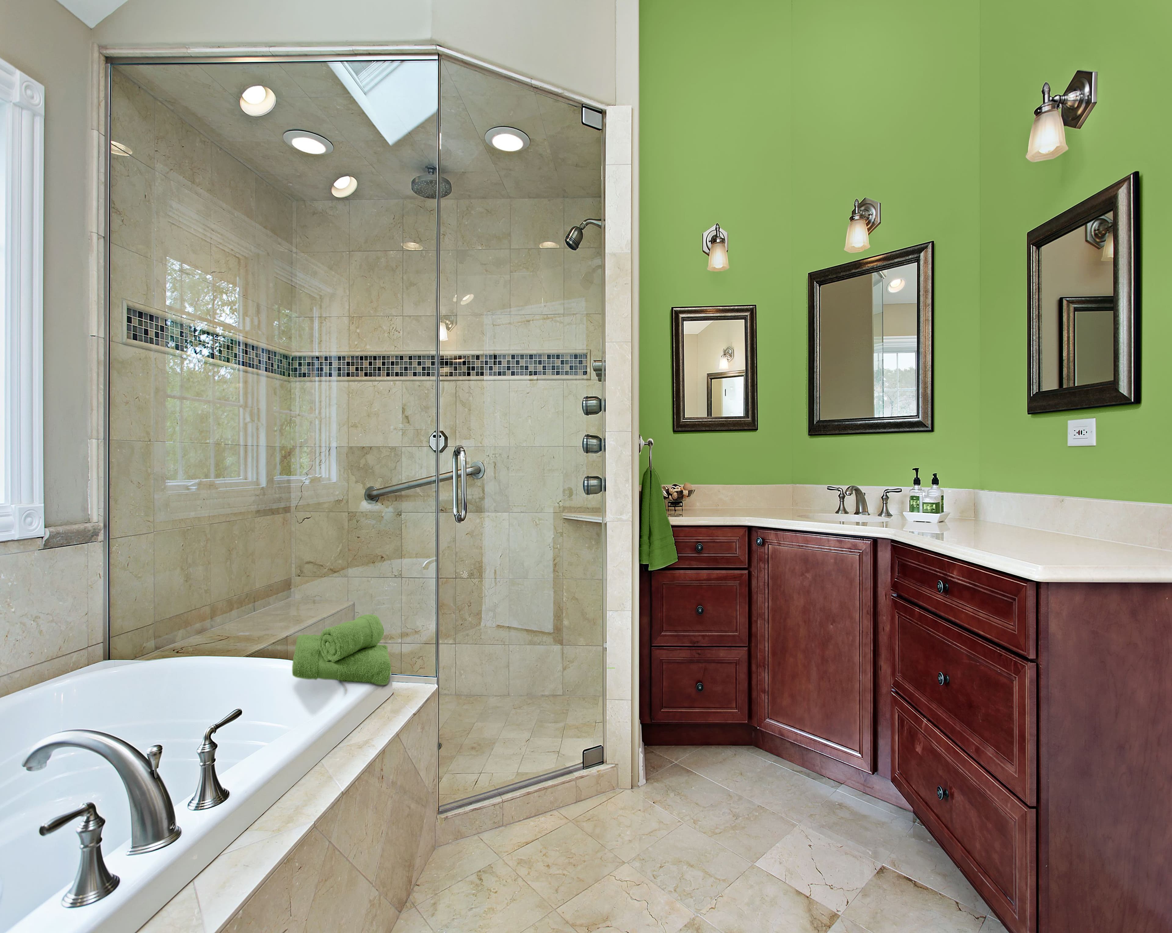 Custom glass shower doors in a modern bathroom with beveled glass edges, stylish mirrors, and a sleek countertop, featuring tempered glass and elegant design elements.